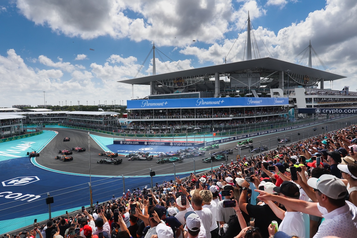 Kimi Antonelli on the top step of the podium holding the winner's trophy after the 2026 Miami Grand Prix on 3 May