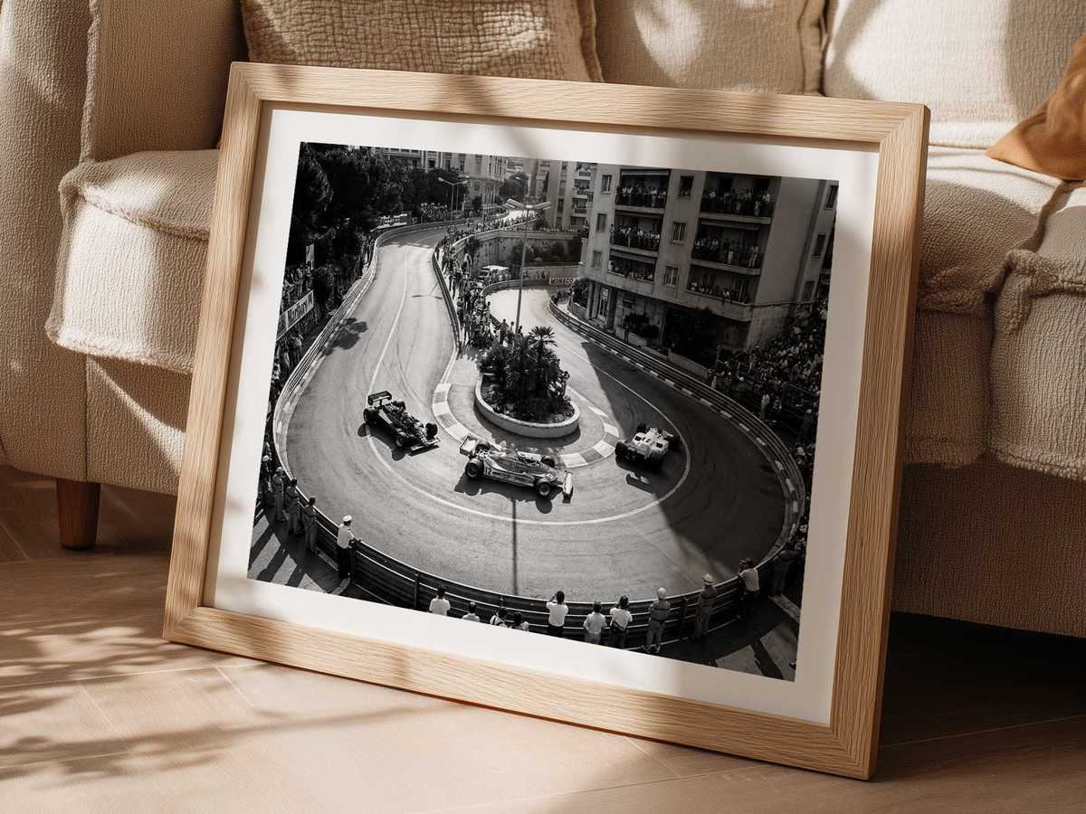 Spectators on balconies and narrow streets packed with racing cars illustrating crowd energy and weekend tension