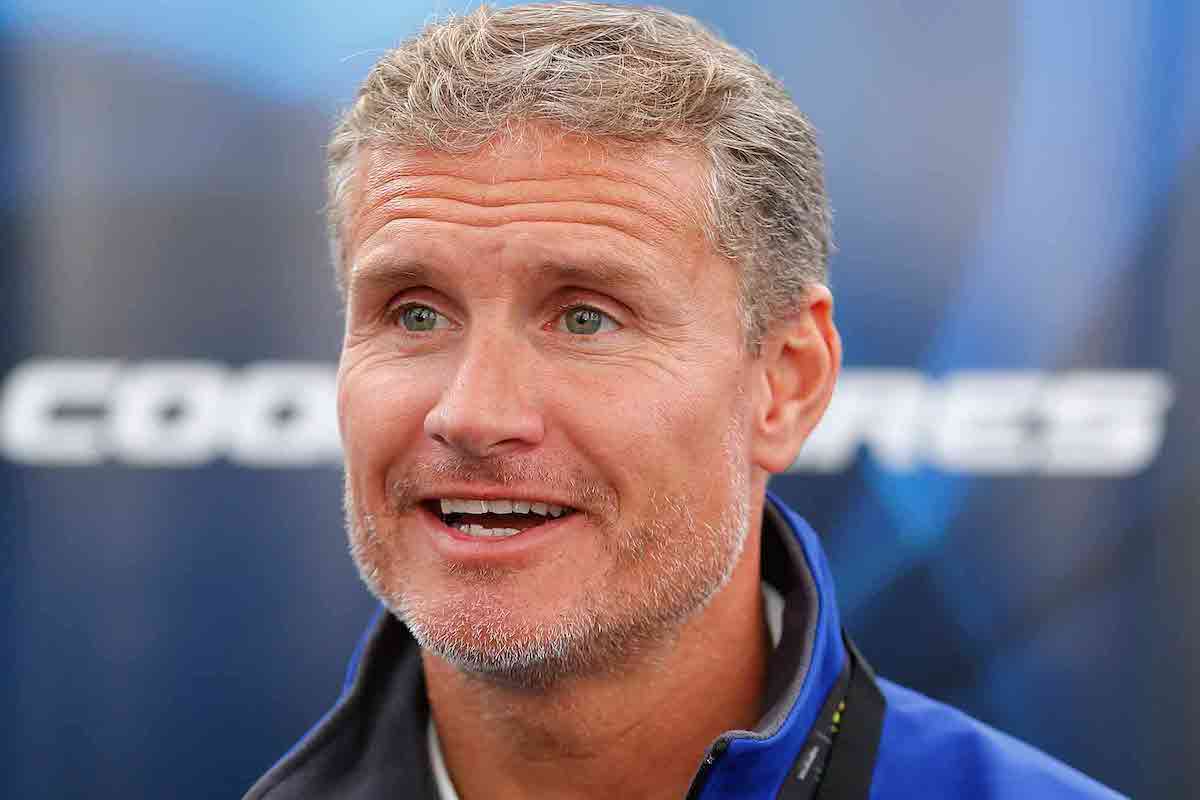 David Coulthard in the cockpit demonstrating upright posture and hand placement on the wheel