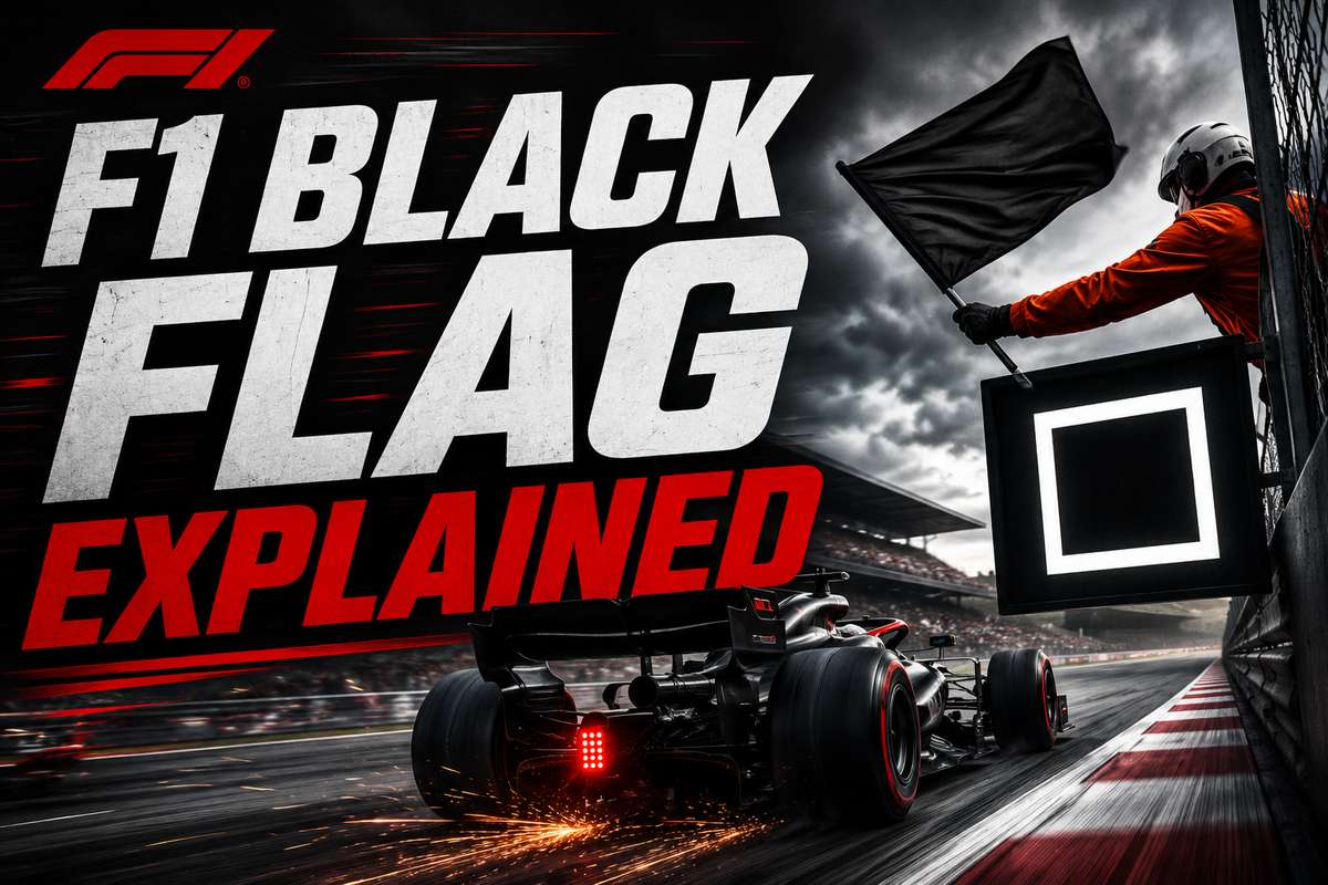 Race marshal holding a black flag on the pit wall near the track signaling a driver to return to the pits