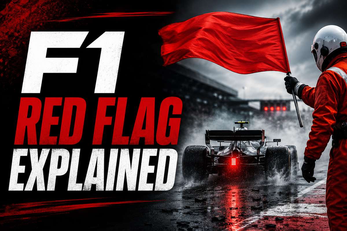 Marshal waving a large red flag at trackside to signal session suspension during a Formula 1 race