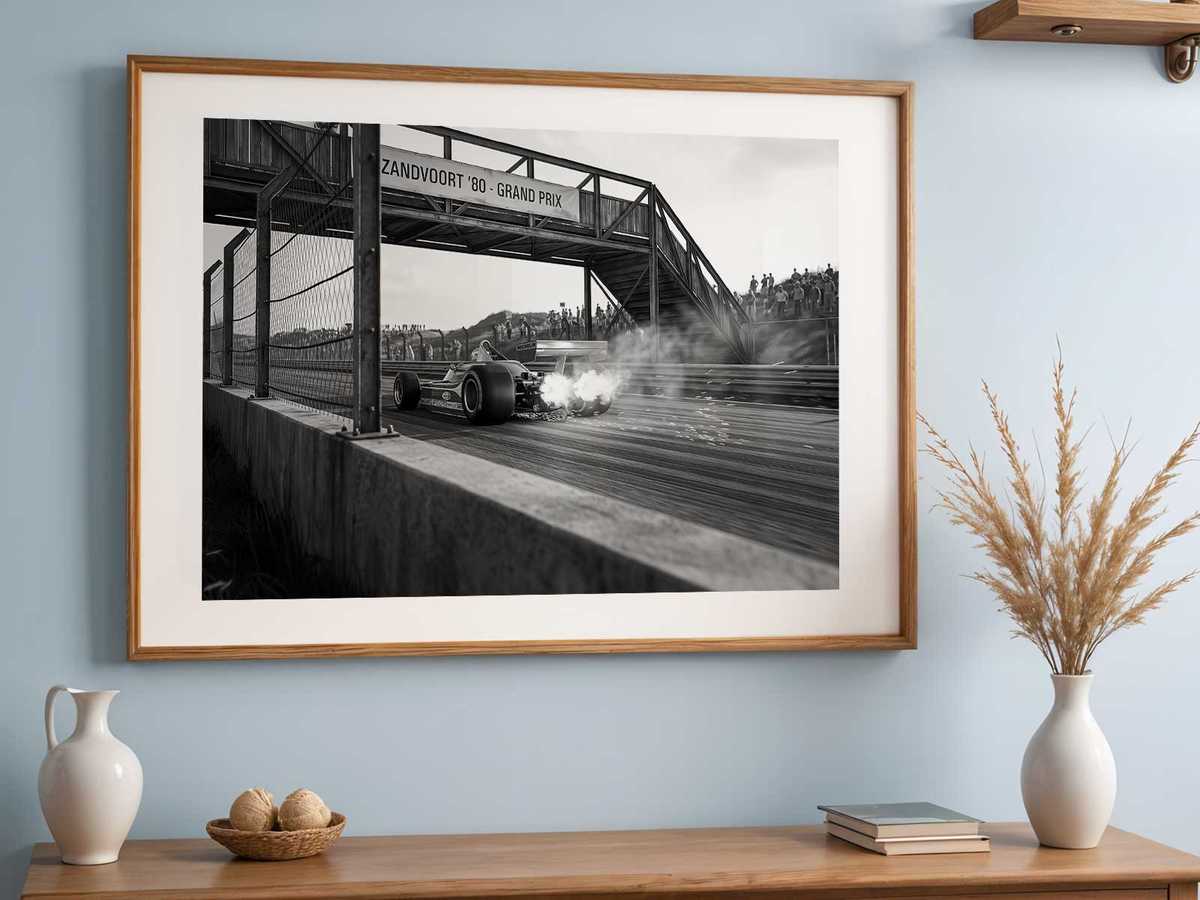Silhouette of the Ferrari 312 T5 set within a framed vintage composition, suggesting a preserved piece of F1 heritage