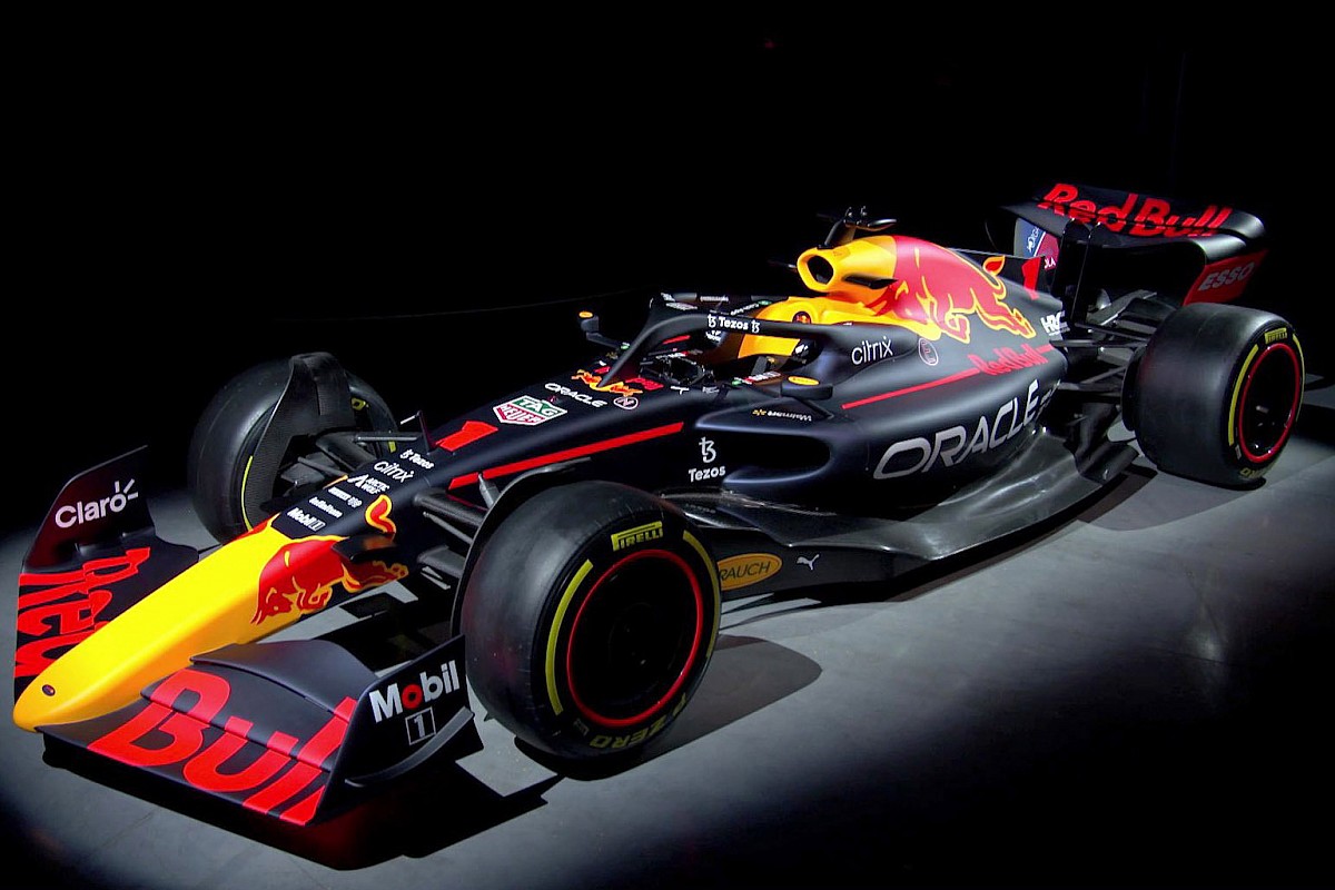 Red Bull Racing car carrying high speed through a high-downforce corner, showing front wing and bargeboards working