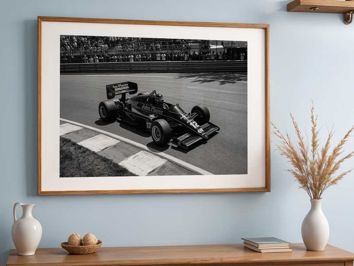 Minimalist graphic poster of a Lotus F1 car reduced to essential lines and color blocks to emphasize silhouette
