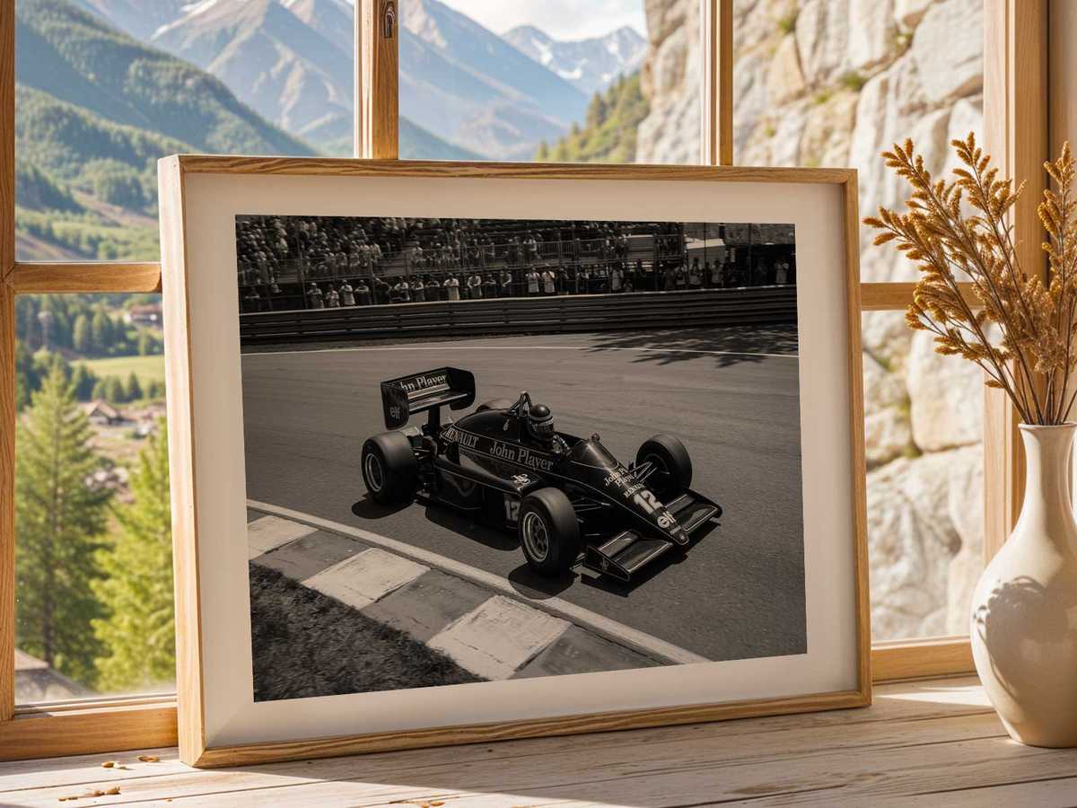 Three-quarter front view of a Lotus F1 car with motion blur to convey high speed and dynamic movement