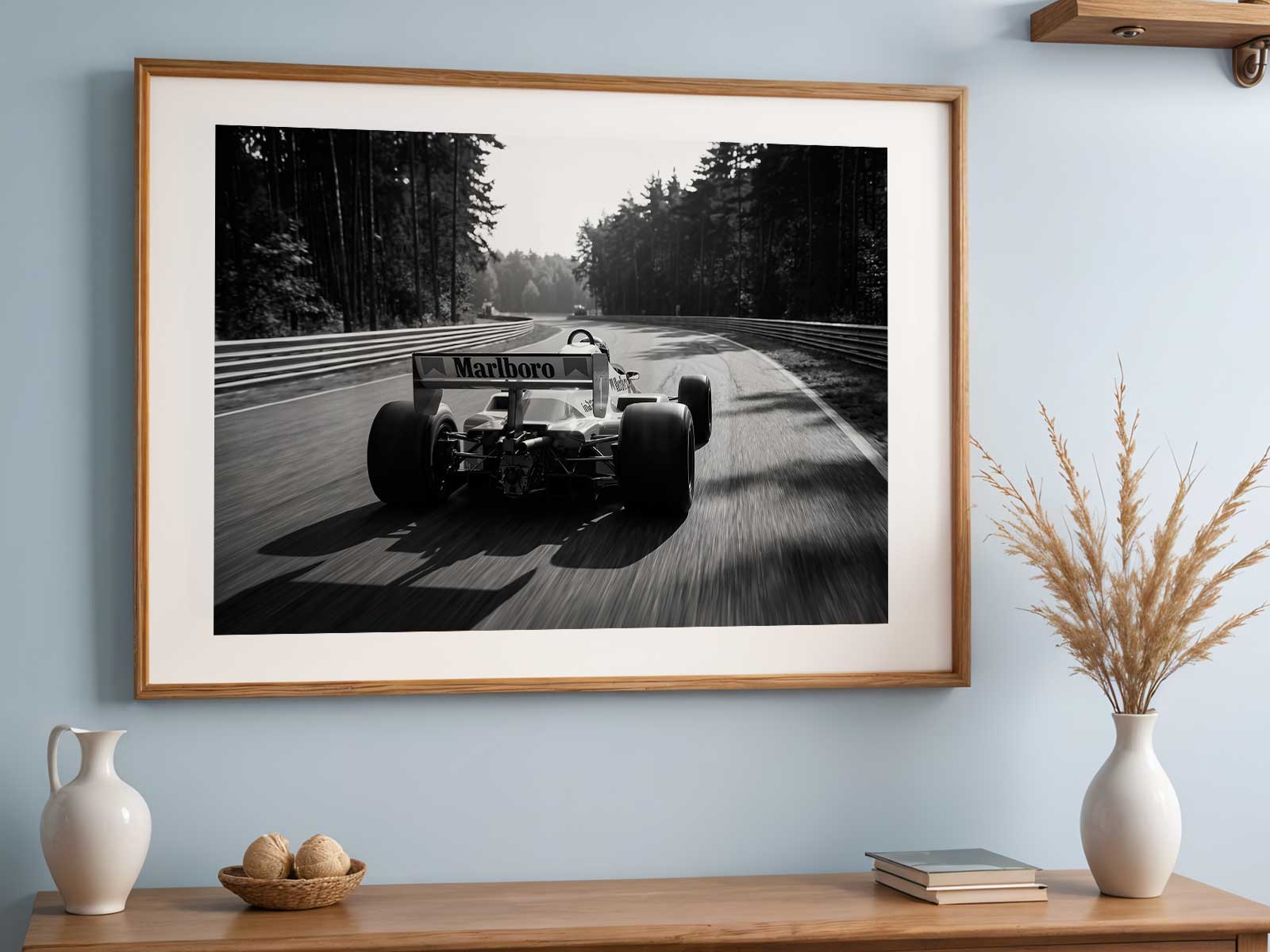 1980s McLaren MP4 captured mid-corner with motion blur conveying speed and the car's distinctive liveried shapes