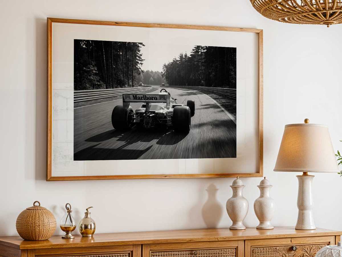 McLaren 80s approaching the pits at Montreal Grand Prix with engineers and vintage signage framing the scene