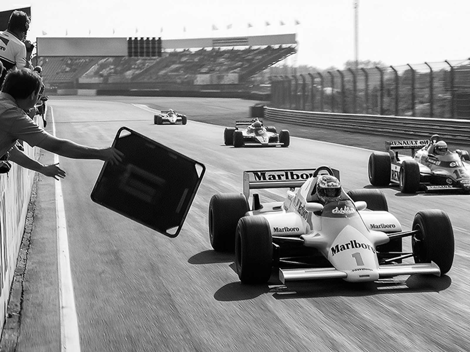 F1 car negotiating Miami stadium kerbs with suspension compression and visible tyre contact