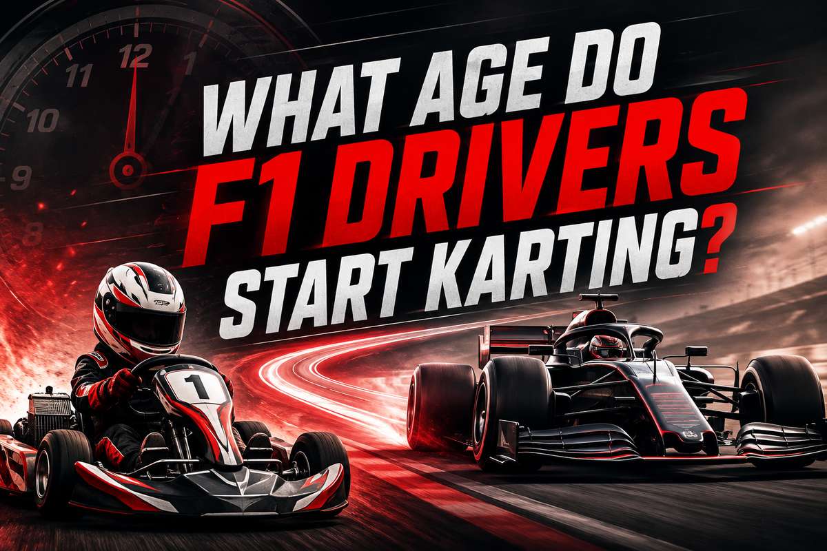 A child in a racing suit and helmet sitting in a small go-kart on a sunny outdoor track preparing to drive for the first time