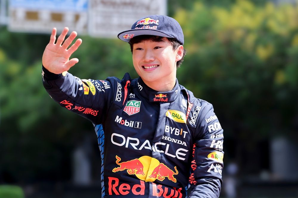 Yuki Tsunoda braking hard into a corner, front tires squirming as he commits to a late turn-in